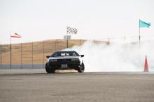 Photo of MARTY at Thunderhill Raceway with smoke and flags in background