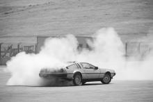 Black and white photo of MARTY with lots of smoke from drifting