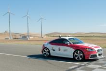 Shelley in foreground with wind turbines in background