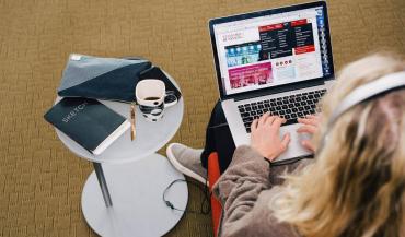 Photo of woman working on laptop