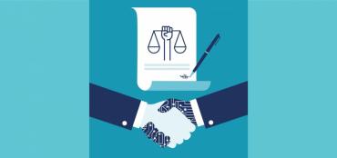 Graphic of scroll with scales of justice with hands of a white person and a black person shaking hands