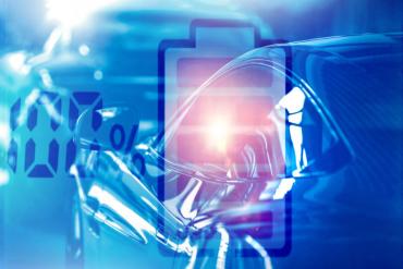 Graphic of a battery reflected onto a vehicle charging with '100%' noted