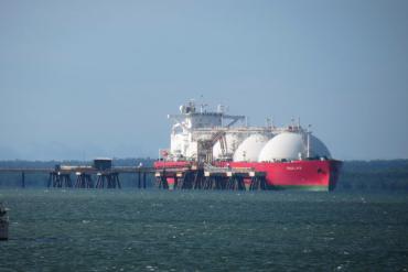 A liquified natural gas tanker at dock. Because of greater supply and cheaper prices, natural gas usage has surged, accounting for 60 percent of fossil emissions growth in recent years. (Image credit: Ken Hodge/Flickr)