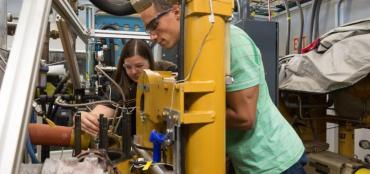Photo of researchers working in an engine lab