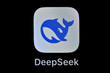 DeepSeek logo with a plump, bright blue whale, accompanied by the brand's wordmark in a rounded, fractured sans-serif font