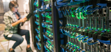 Worker in a data center working on servers