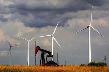 Photo of wind rubines and an oil pumpjack in Sweetwater, Texas