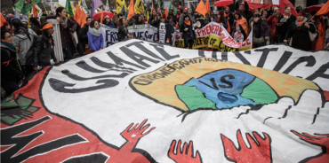 Activists rally during the COP21 climate negotiations held in Paris, France in December 2015. (Image credit: Agung Parameswara/Getty Images)