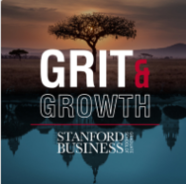 Photo showing a tree at dusk with mountains in the distance with a reflection of a city on the bottom