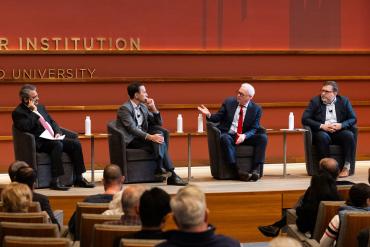 Photo of participants on stage at the Hoover Institution event.
