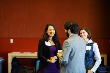 Photo of people in conference room talking