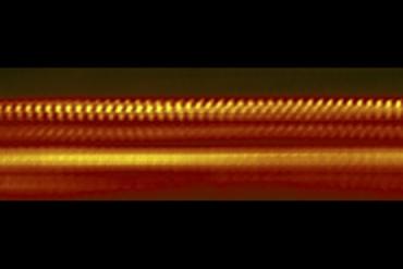 This greatly magnified image shows four layers of atomically thin materials that form a heat-shield just two to three nanometers thick, or roughly 50,000 times thinner than a sheet of paper. (Image credit: National Institute of Standards and Technology)