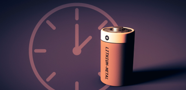 Graphic of a battery in the foreground with a clock in the background