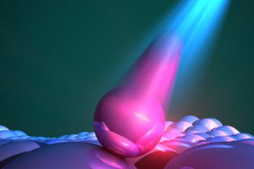 A close-up artist’s rendering of quantum dots emitting light they’ve absorbed.