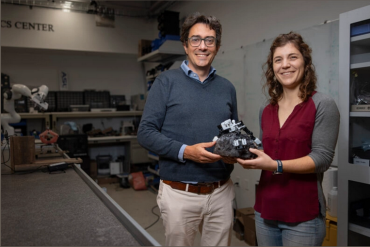 Associate Professor Marco Pavone and PhD student Stephanie Newdick holding a prototype of a gripper robot designed constructed in Mark Cutkosky’s Biomimetic and Dexterous Manipulation Lab. (Image credit: Andrew Brodhead)