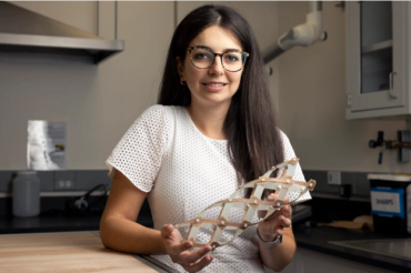 Photo of Assistant Professor Maria Sakovsky and a portable antenna she co-designed