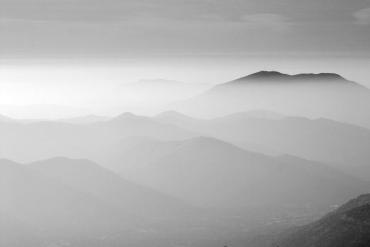 Photo of mountains with smoky haze covering landscape