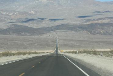 Graphic of a road going on into the mountains