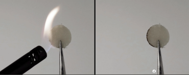 Photo of flame on a round pad being held up with tweezers