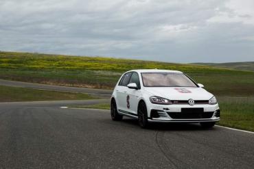 Photo of the Stanford Dynamic Design Lab's VW GTI testing at Thunderhill Raceway in Willows, CA.